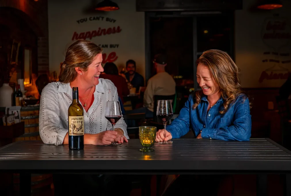 Two Women enjoying Jumping Cholla Beverages Arizona Red Wine